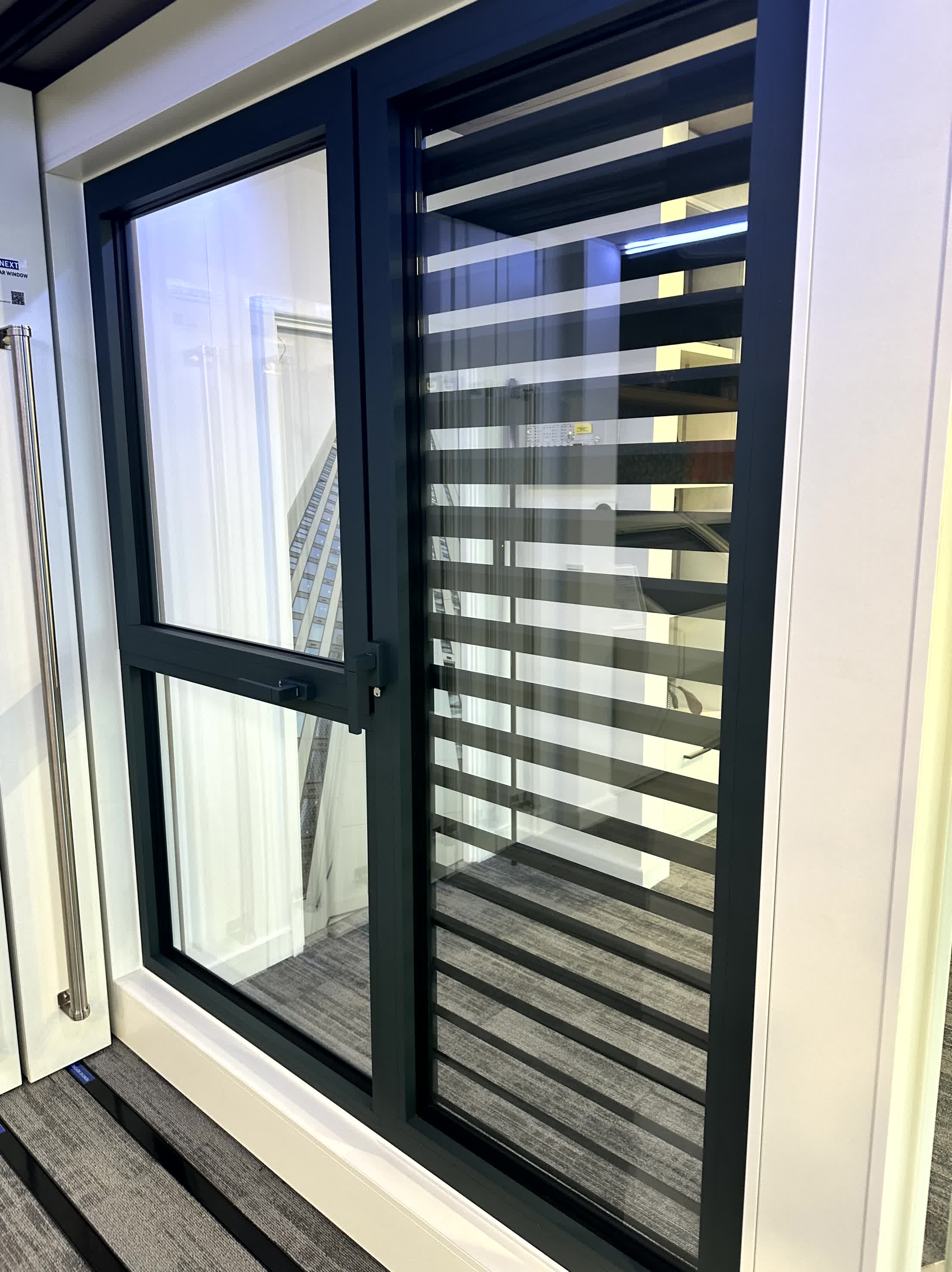 Advanced Glass installing aluminium brise soleil to reduce solar gain and improve building energy performance.
