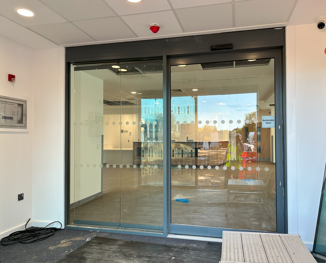 Advanced Glass installing aluminium automatic glass doors for smooth, reliable, and compliant building access.