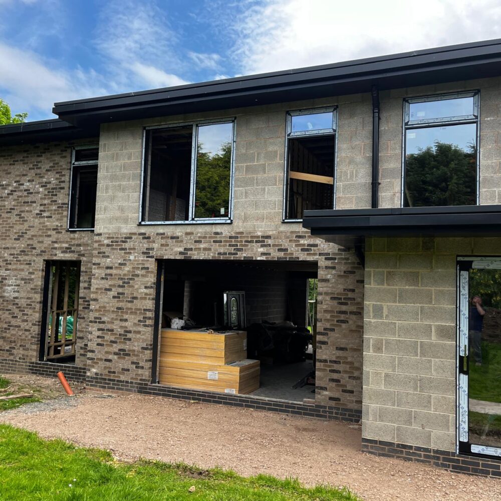 Glass to glass corner window detail at high end home in Market Bosworth