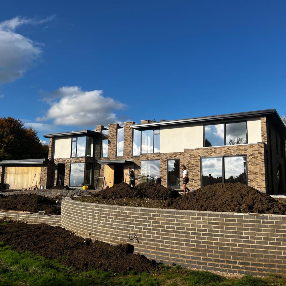 Aluminium façade glazing and sliding doors at Paddock House Leicestershire