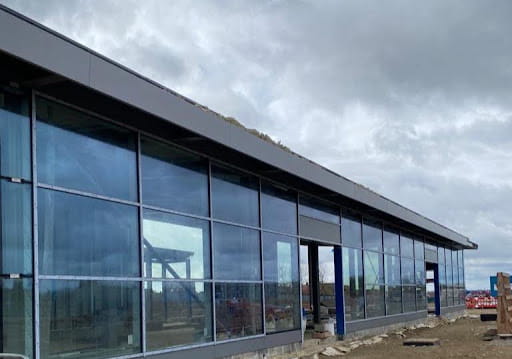 Fire-rated glazing being used on a commercial project after the QS compared which tender provided the best value to the company.